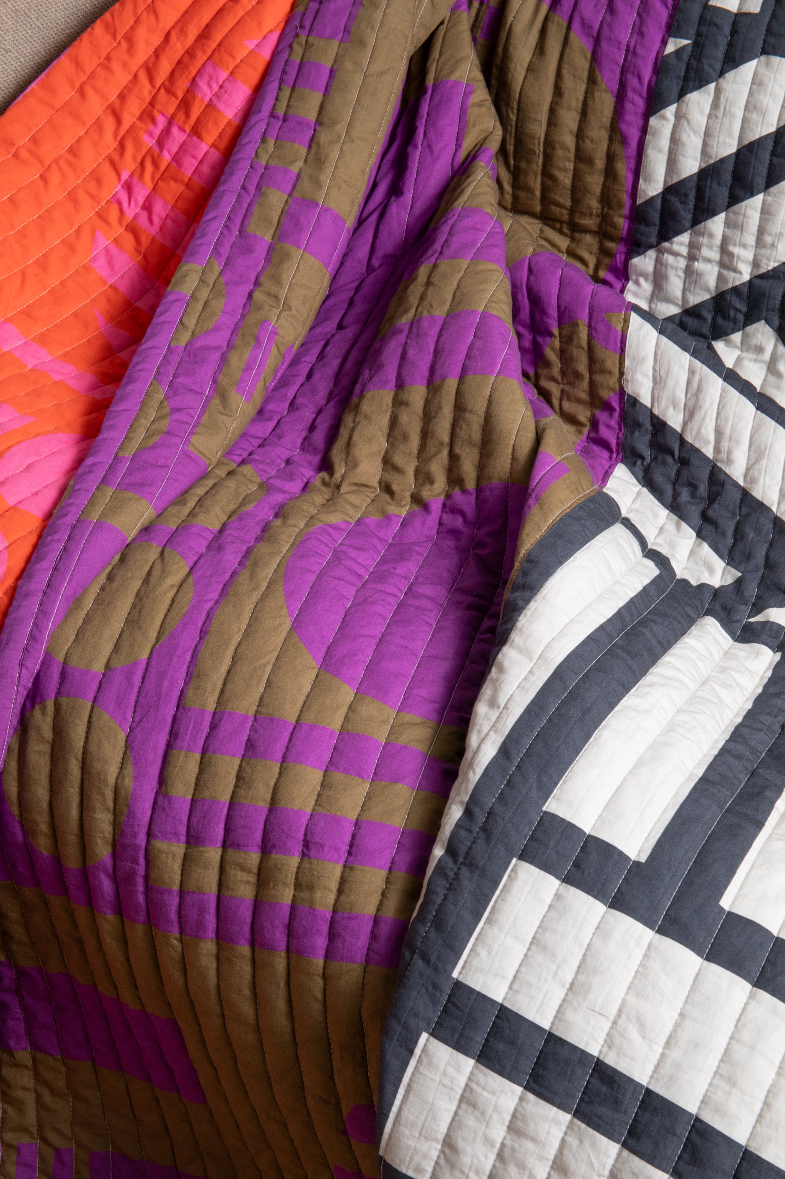 Reversible Quilted Throw in Hot Grape