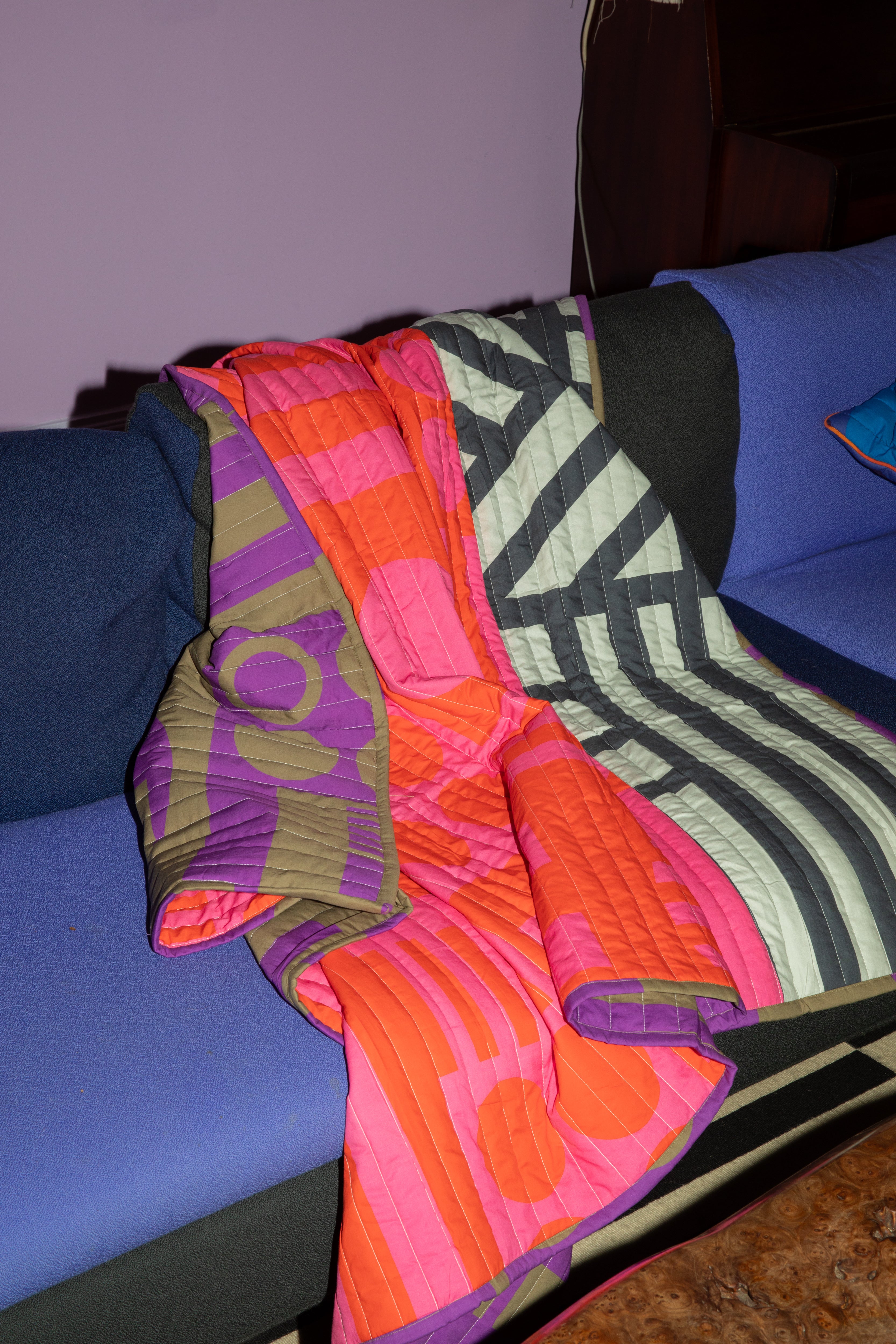 Reversible Quilted Throw in Hot Grape