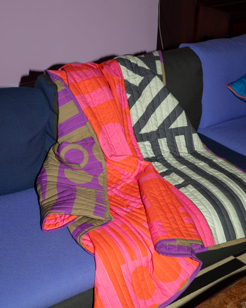 Reversible Quilted Throw in Hot Grape