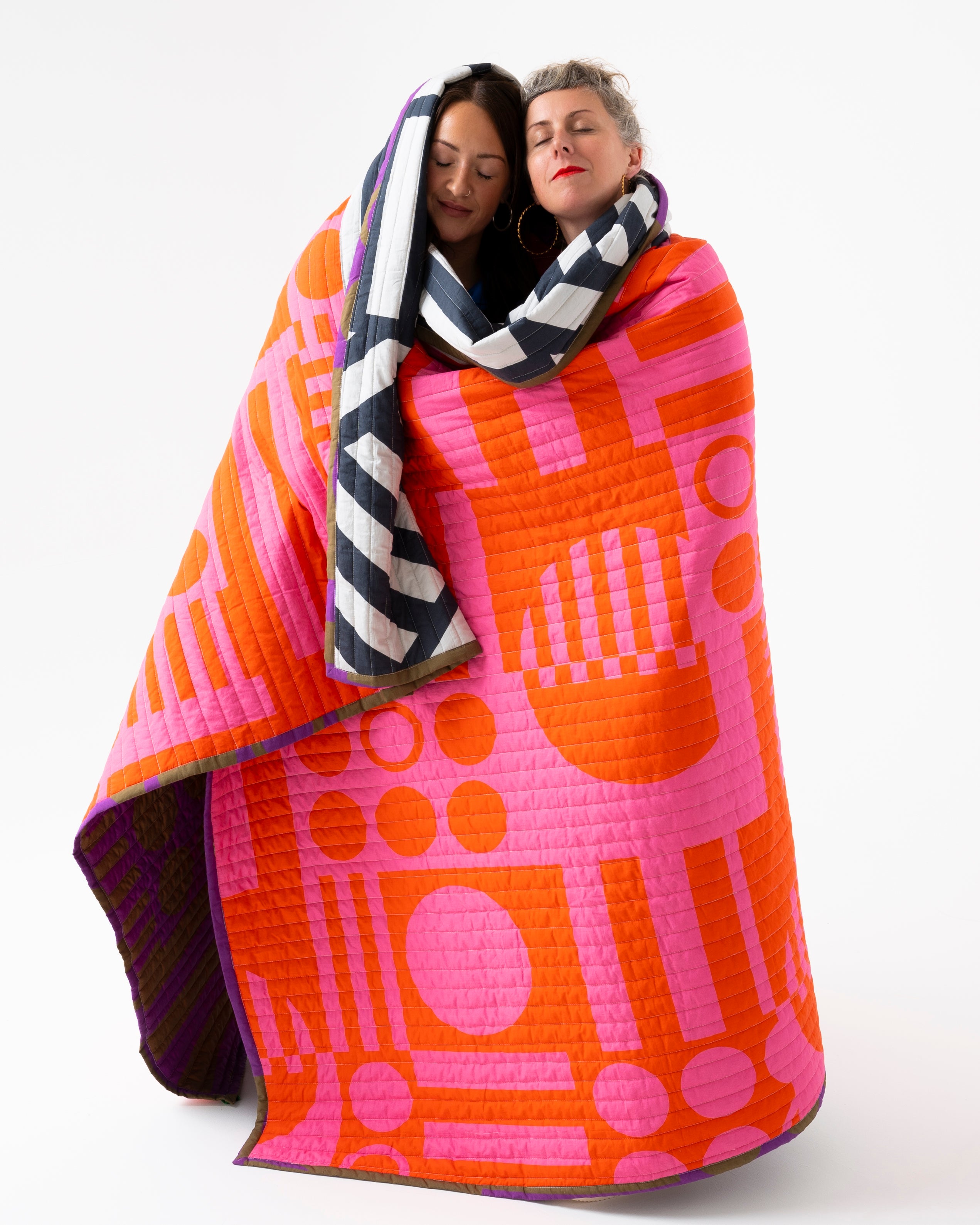 Reversible Quilted Throw in Hot Grape